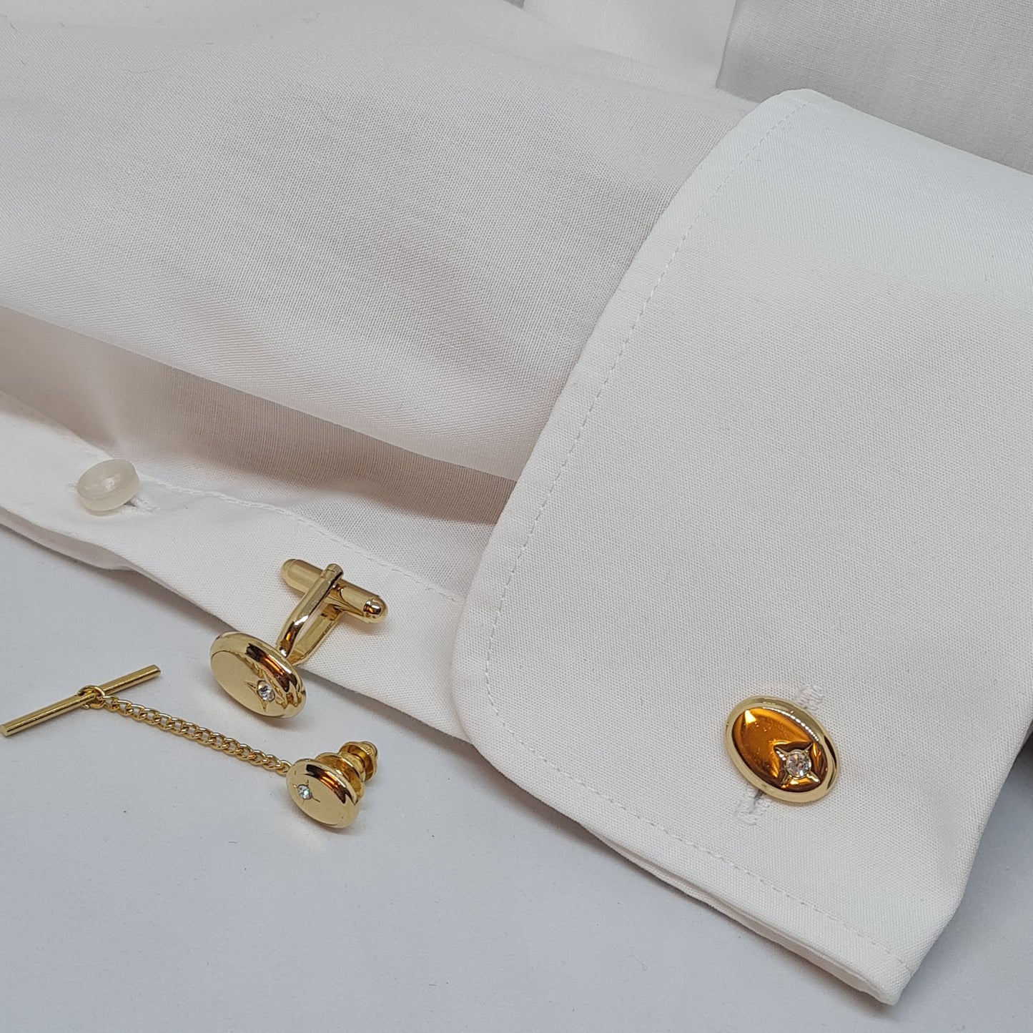 Vintage tiny cufflinks & tie tack set Gloss gold-tone oval cuff links with clear rhinestones