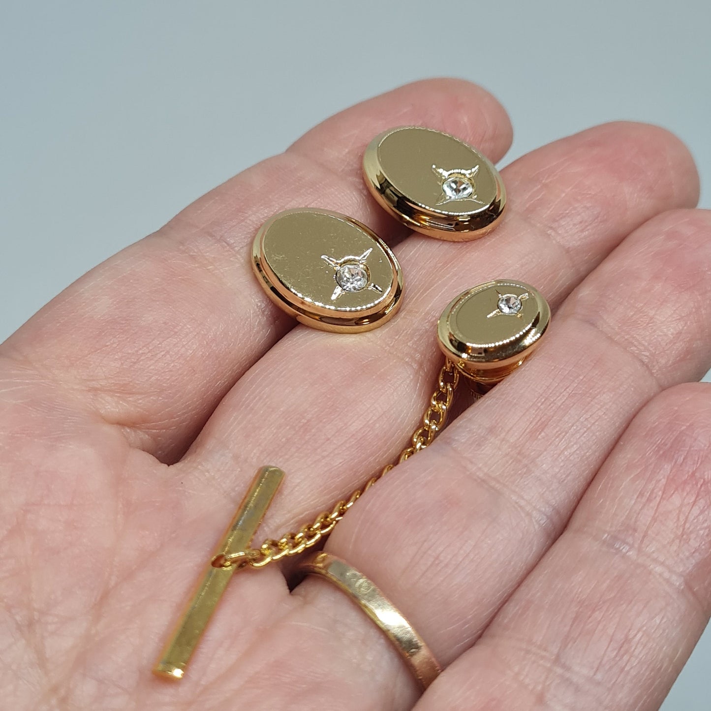 Vintage tiny cufflinks & tie tack set Gloss gold-tone oval cuff links with clear rhinestones