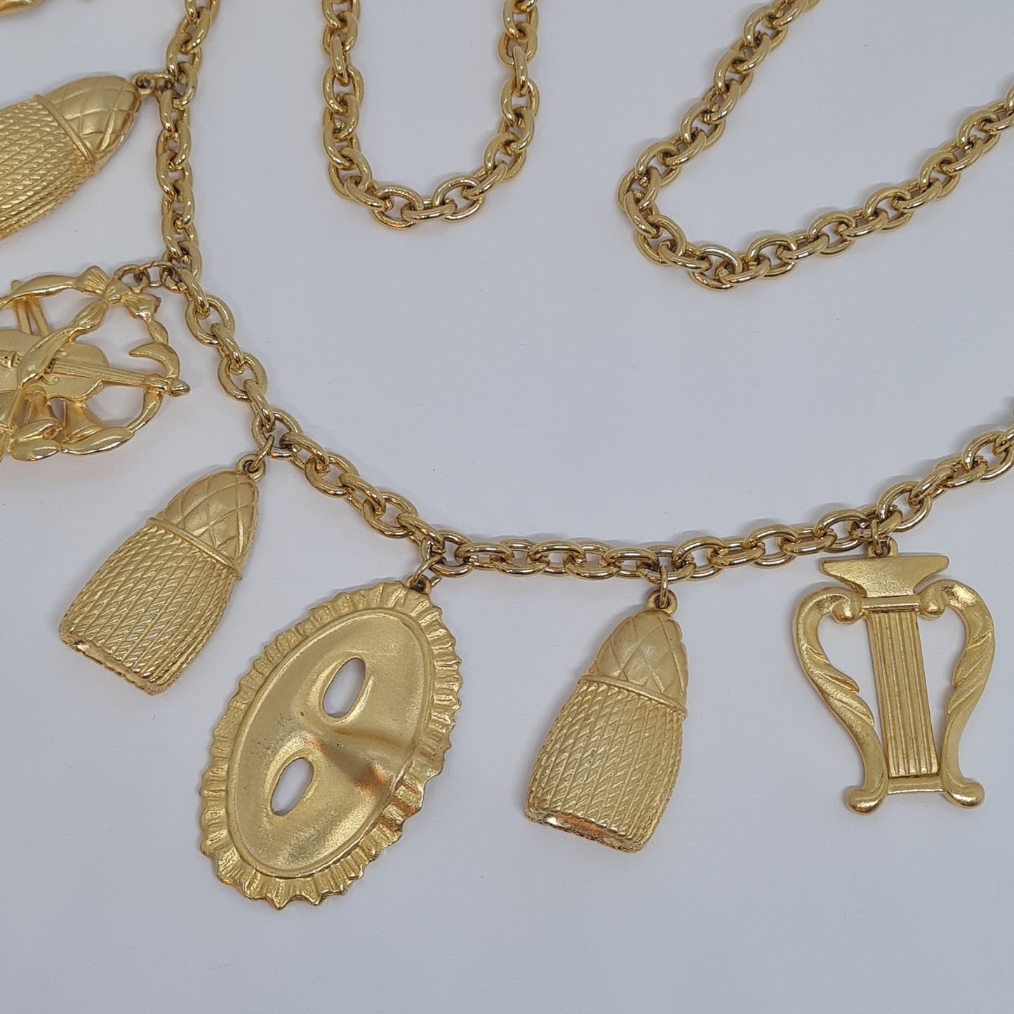Vintage music-themed pendant necklace Gold-tone metal chain with Arfa, tassel, mask, violin pendants Original pendant necklace