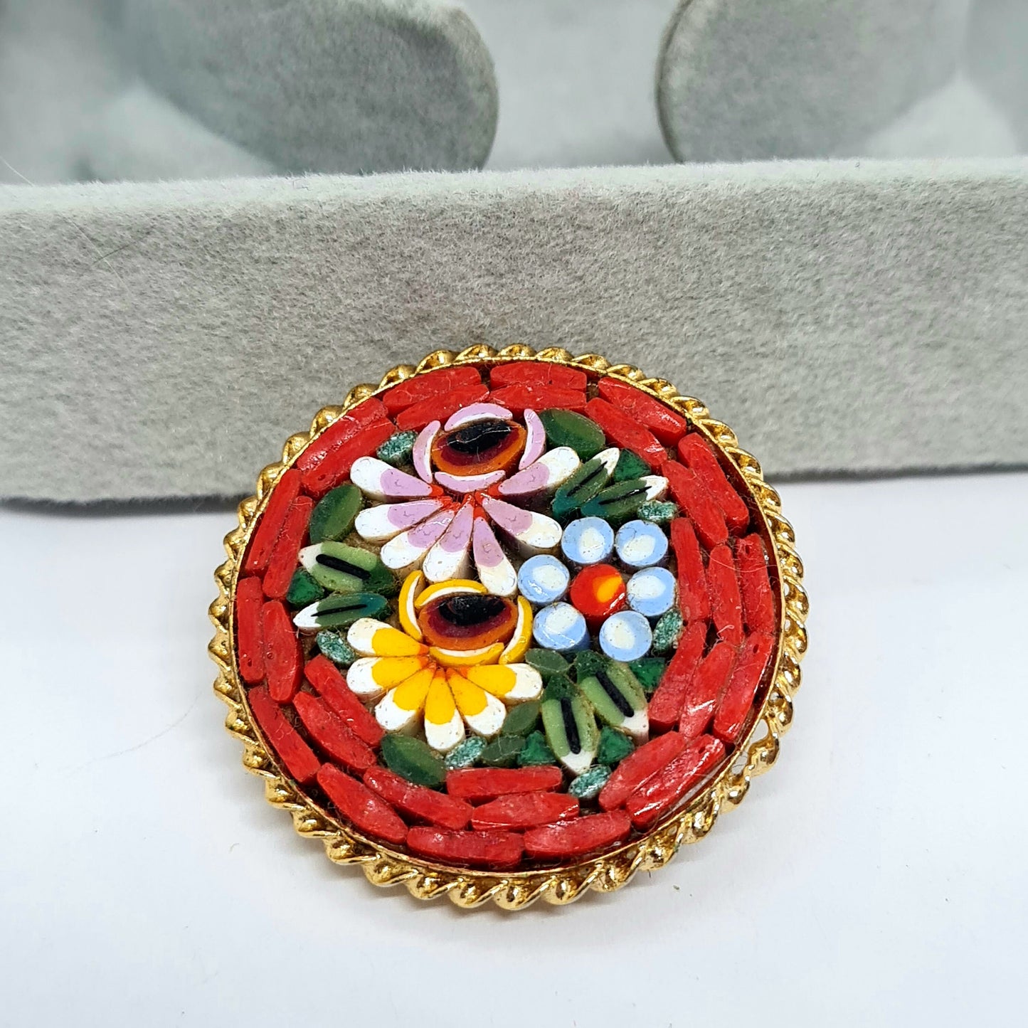 Vintage micro mosaic brooch Gold-tone metal with red, blue, and white glass micro mosaic brooch pin