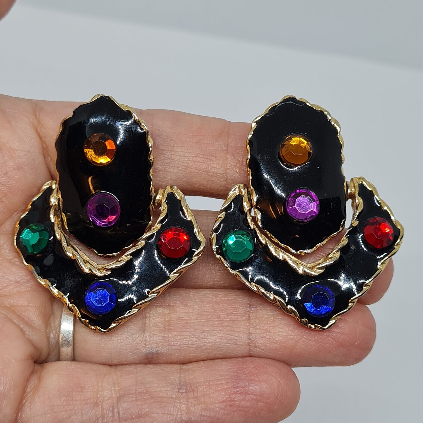 Vintage chunky door knocker clip earrings Textured gold tone metal with black enamel and plastic rhinestones