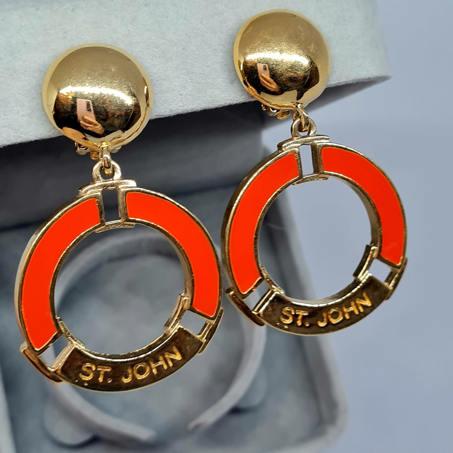 Vintage ST.JOHN clip earrings nautical style Gold tone metal with orange enamel Designer chunky circle clip on earrings