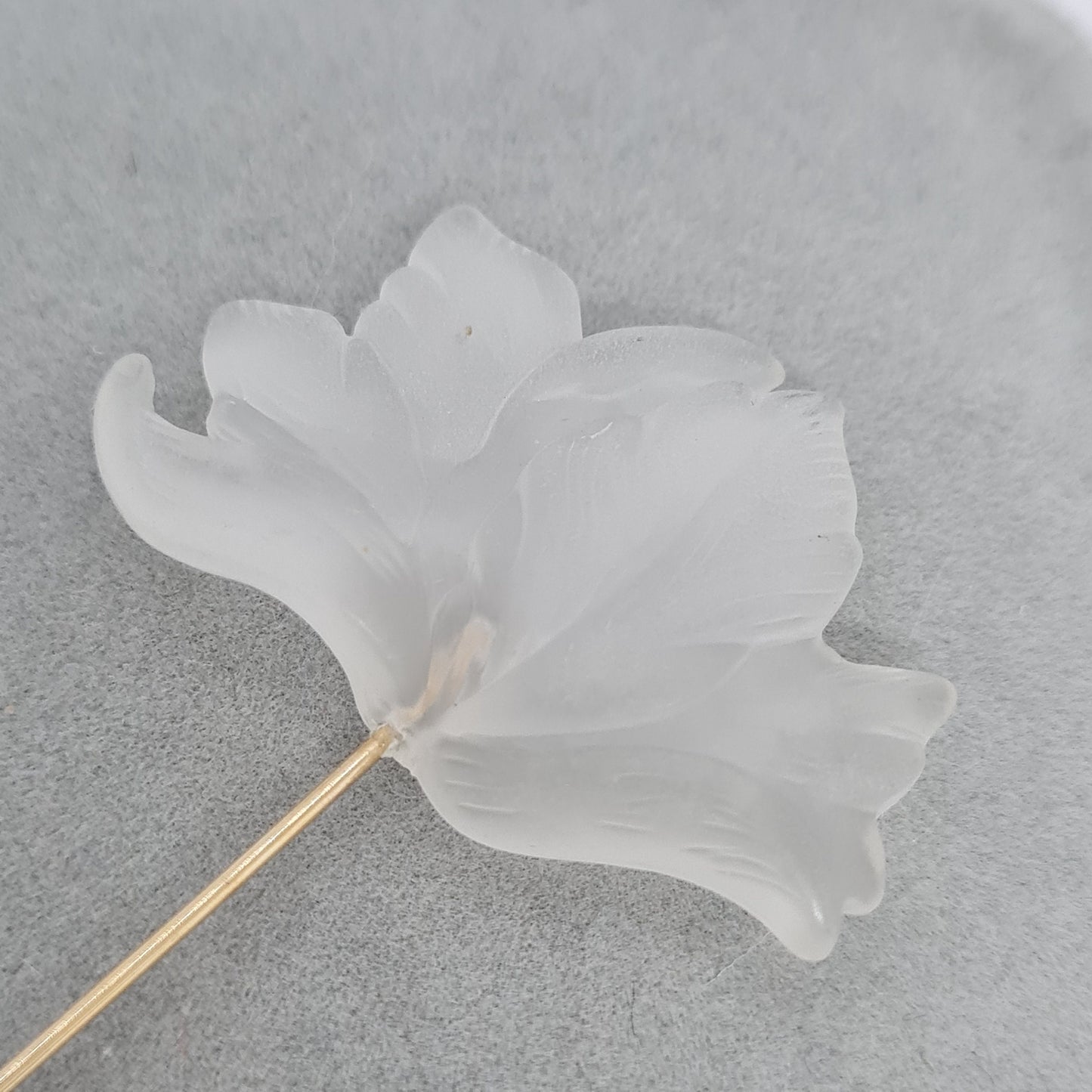 Vintage frosted Lucite stick pin. Gold-tone metal with clear frosted plastic flower stick pin.