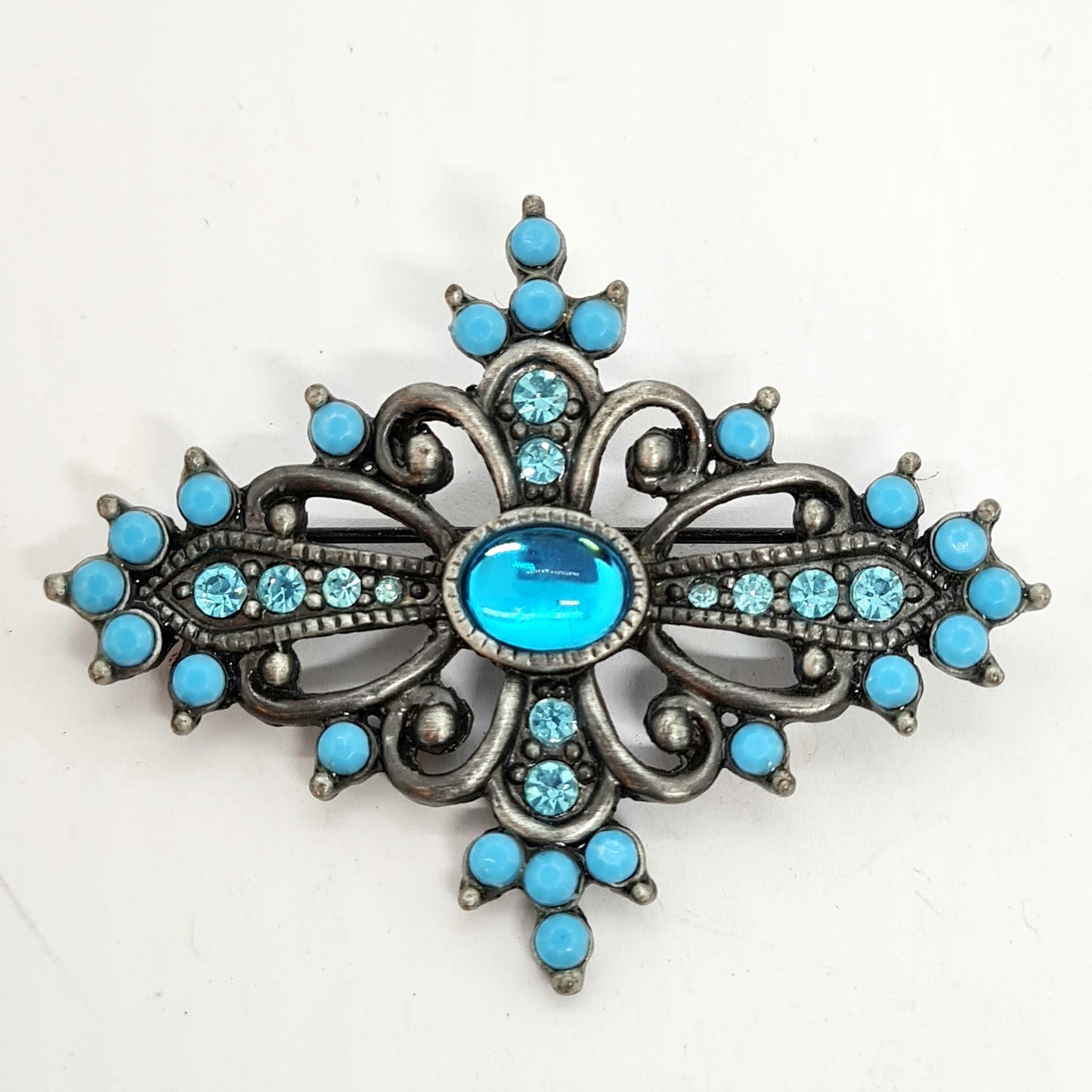 Vintage Victorian style brooch Silver tone metal with blue plastic and glass rhinestones brooch pin