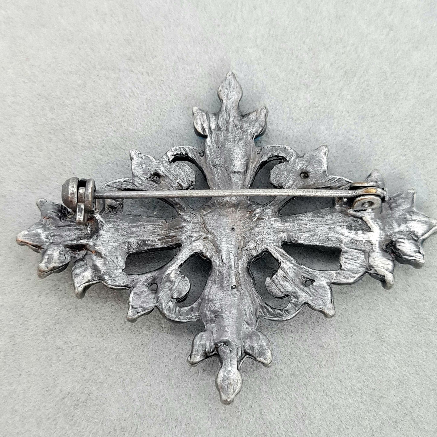 Vintage Victorian style brooch Silver tone metal with blue plastic and glass rhinestones brooch pin