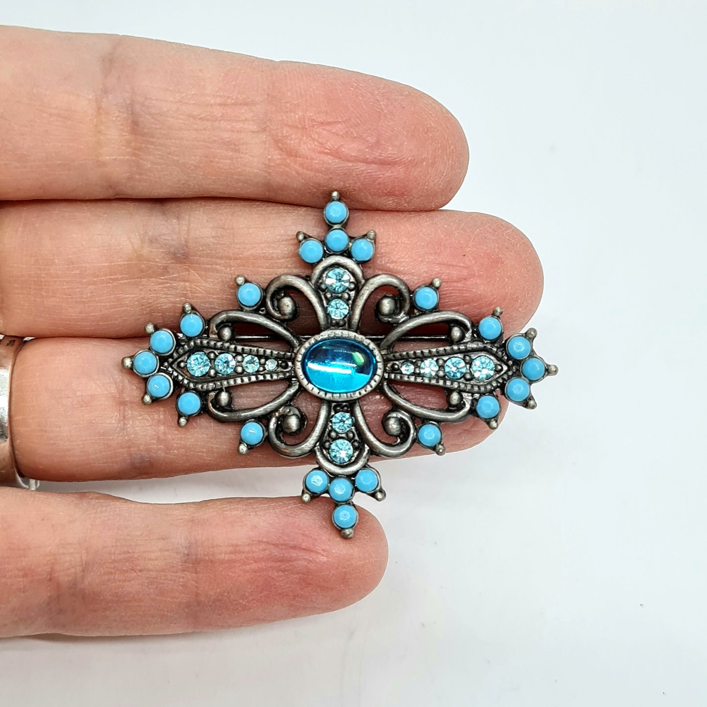 Vintage Victorian style brooch Silver tone metal with blue plastic and glass rhinestones brooch pin