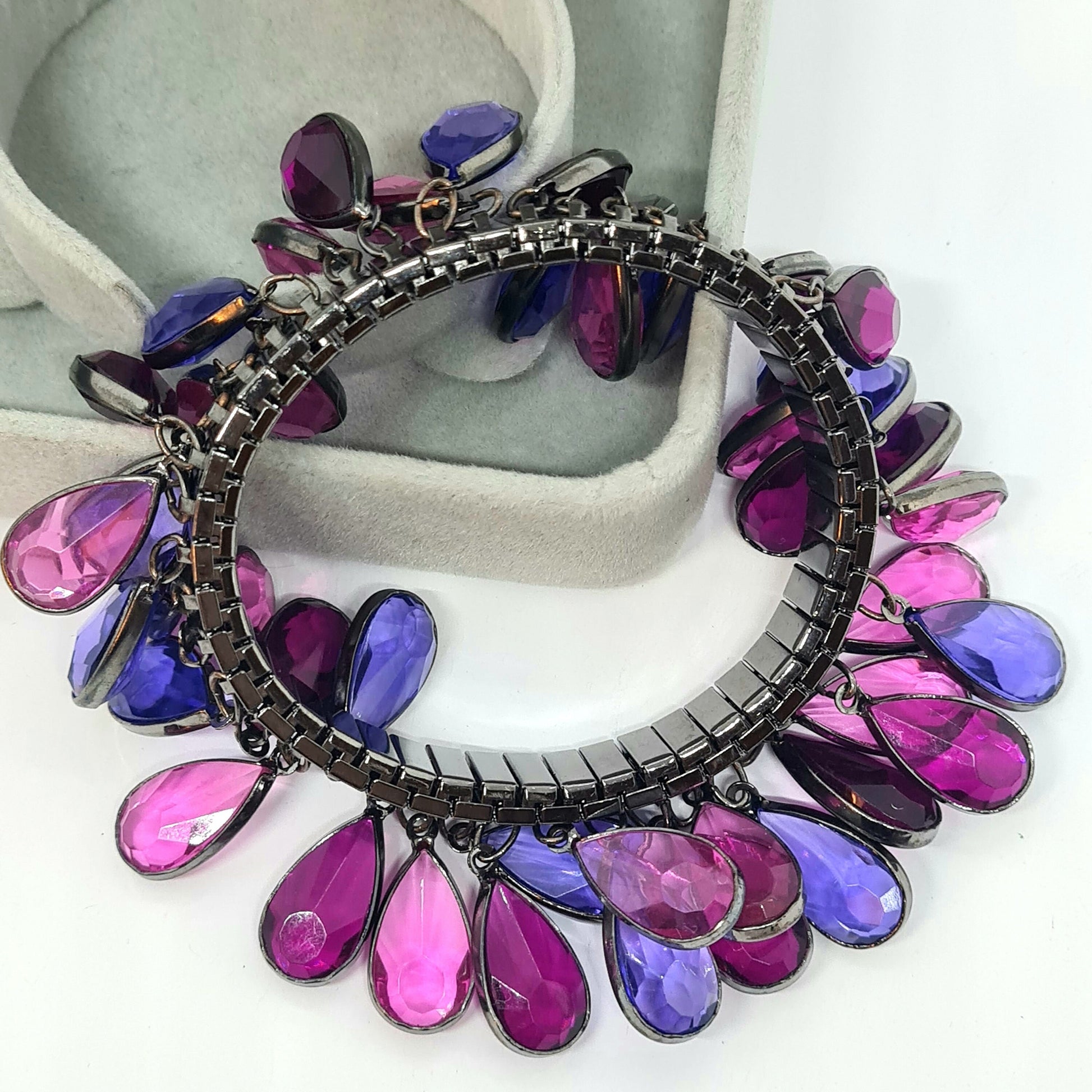 Vintage expanding flex bracelet with purple plastic bezel charms Black tone metal cha cha bracelet
