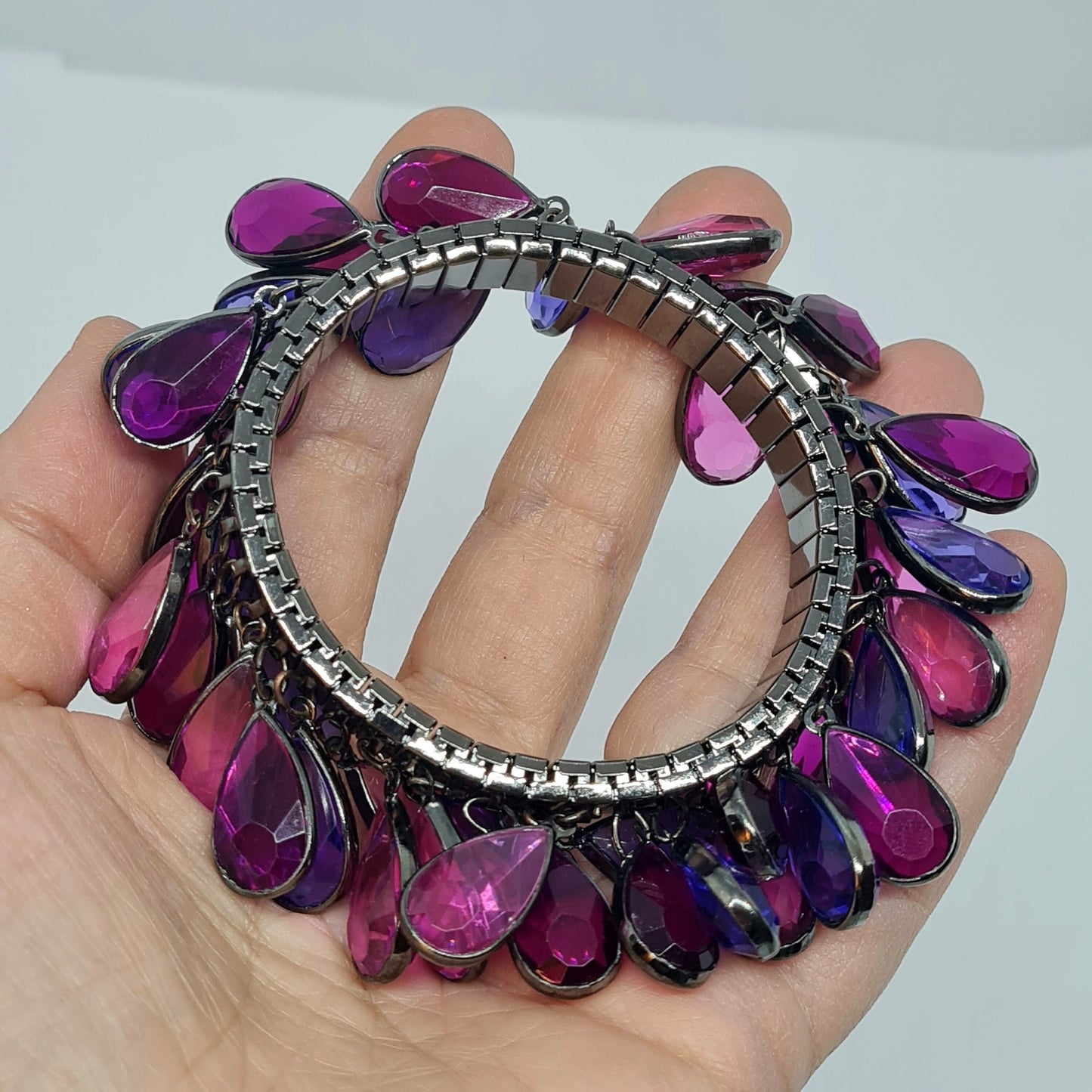 Vintage expanding flex bracelet with purple plastic bezel charms Black tone metal cha cha bracelet
