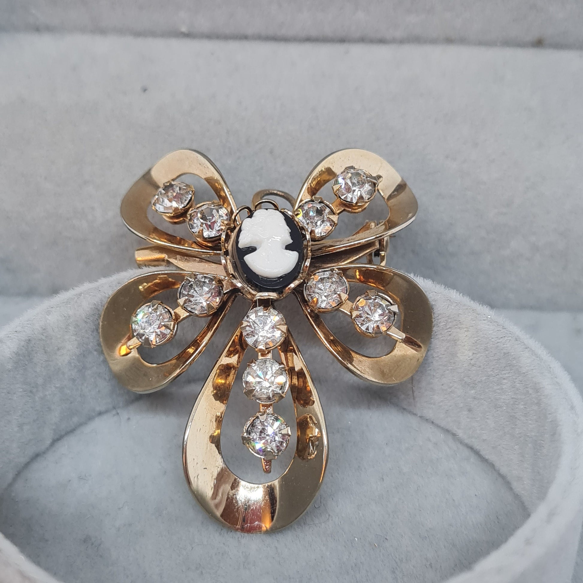 Vintage Cameo brooch pendant Gold tone metal with tiny black and white tone plastic cabochon and clear rhinestones