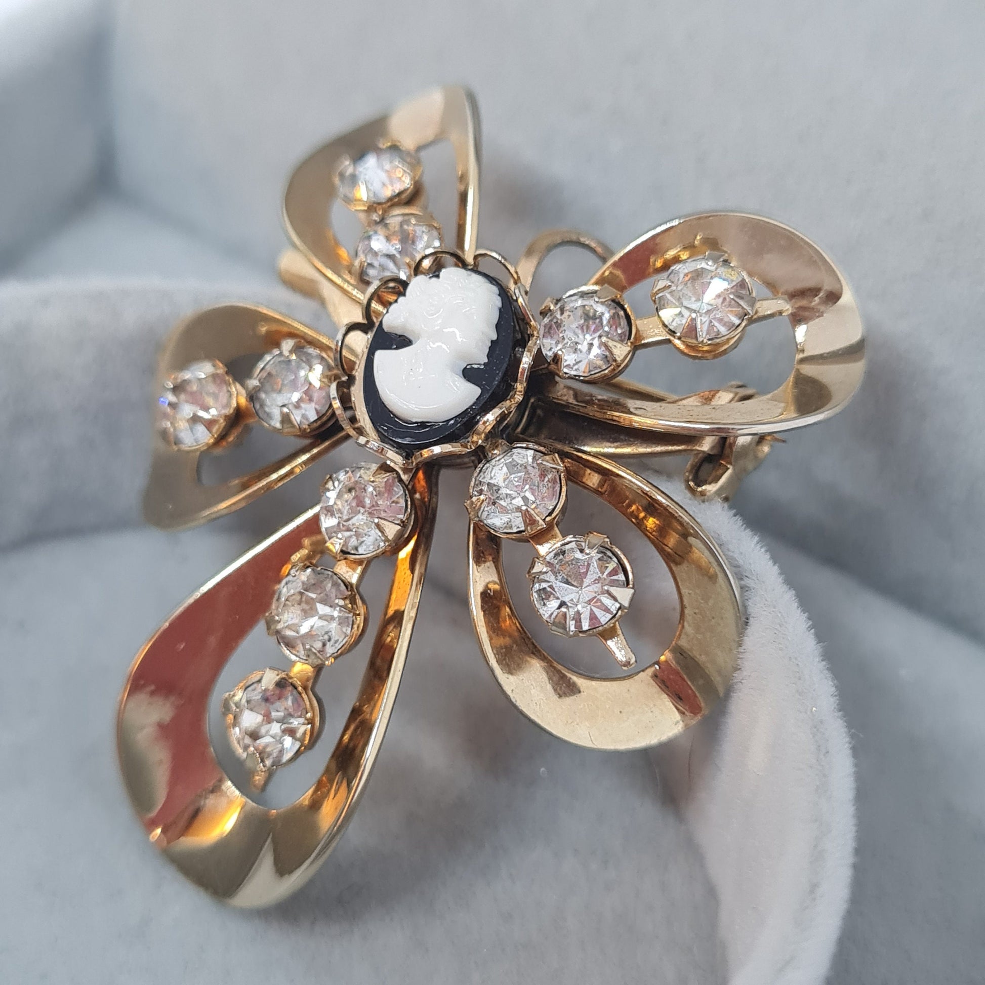 Vintage Cameo brooch pendant Gold tone metal with tiny black and white tone plastic cabochon and clear rhinestones