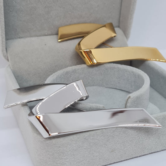 Vintage MONET ribbon brooch. Silver or gold-tone textured and gloss metal. Designer abstract wave brooch pin.