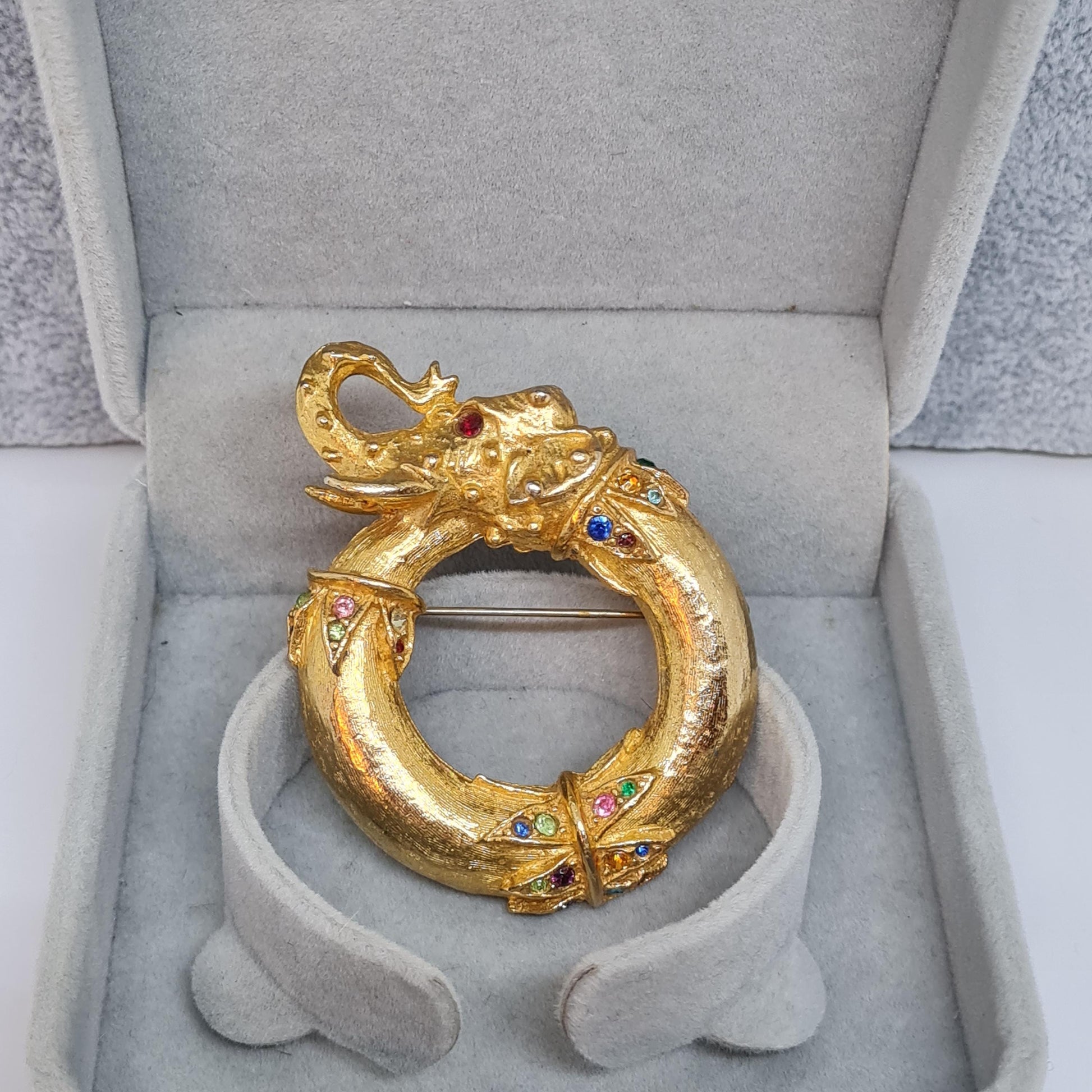 Vintage circus elephant brooch Circle gold-tone metal with rainbow glass rhinestone brooch pin