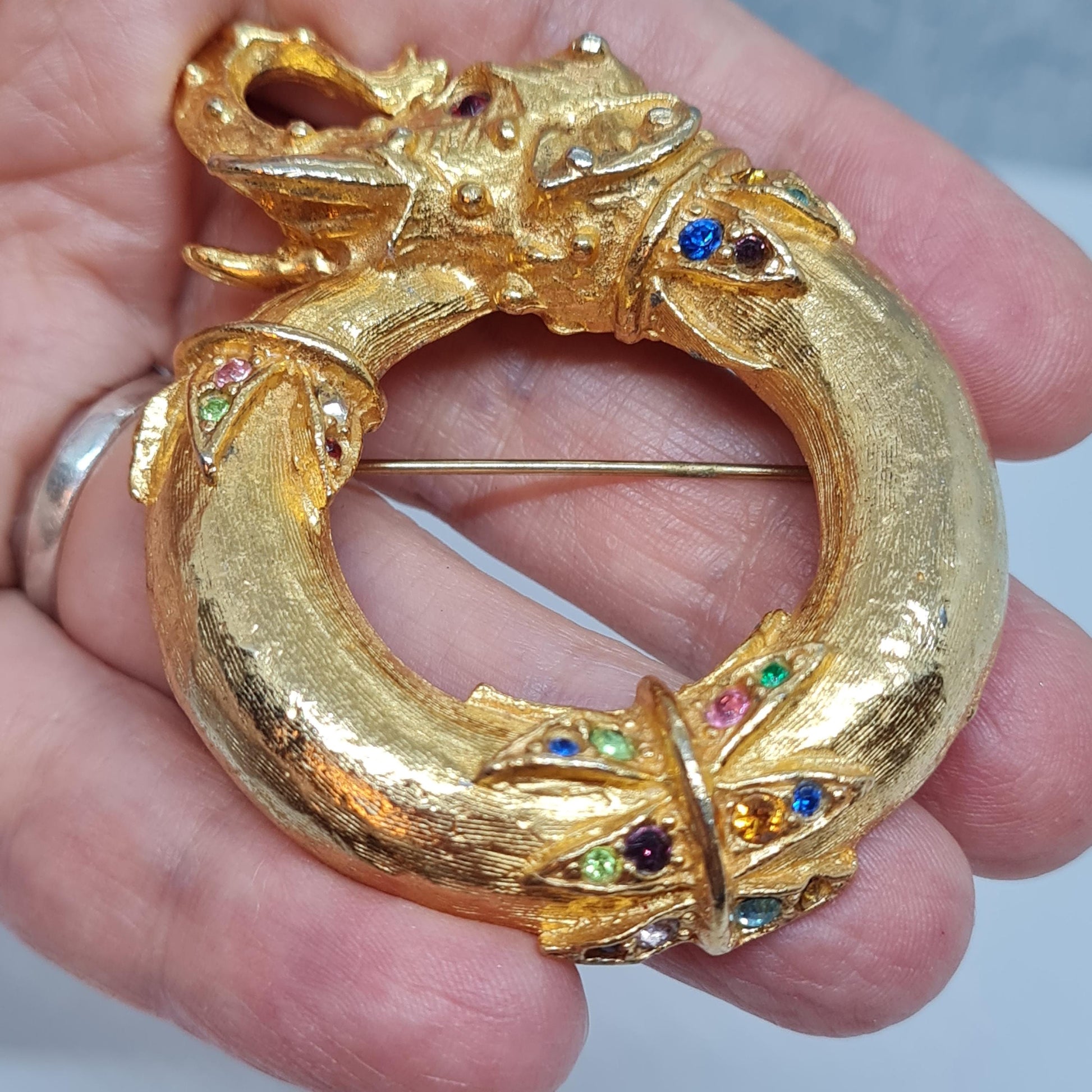 Vintage circus elephant brooch Circle gold-tone metal with rainbow glass rhinestone brooch pin