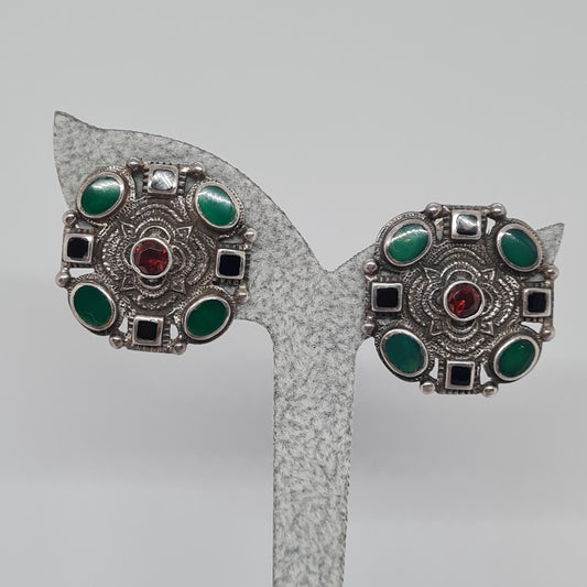 Vintage 925 NF clip earrings. Sterling silver with green and black enamel, and red rhinestone. Etruscan style clip-on earrings.