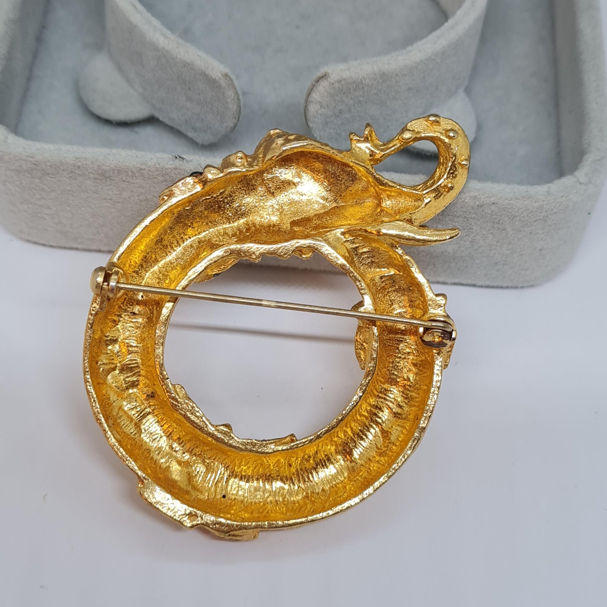 Vintage circus elephant brooch Circle gold-tone metal with rainbow glass rhinestone brooch pin