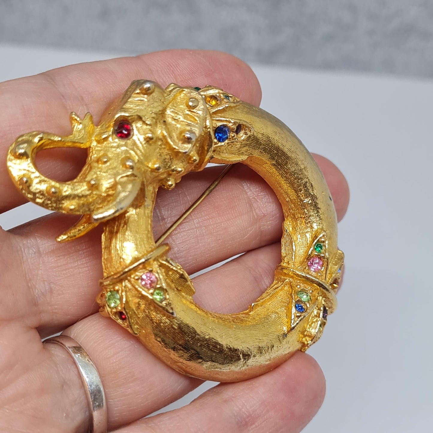 Vintage circus elephant brooch Circle gold-tone metal with rainbow glass rhinestone brooch pin