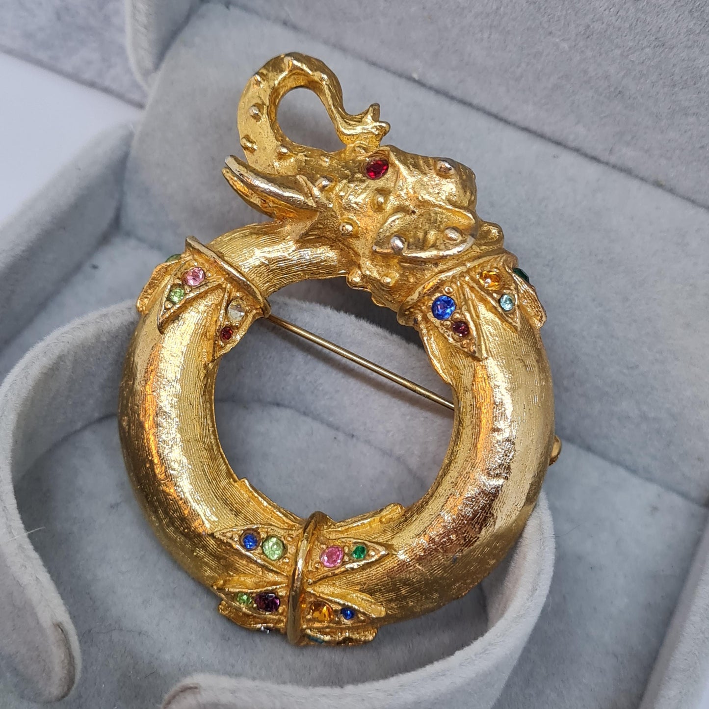 Vintage circus elephant brooch Circle gold-tone metal with rainbow glass rhinestone brooch pin