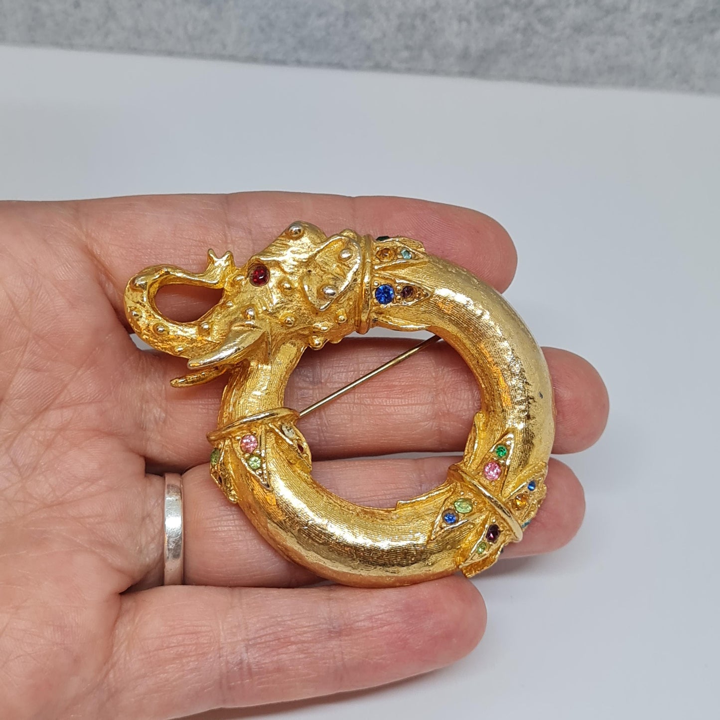 Vintage circus elephant brooch Circle gold-tone metal with rainbow glass rhinestone brooch pin