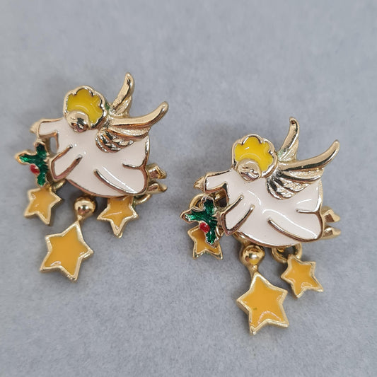 Vintage Christmas angel earrings. Gold-tone metal with white and yellow enamel. Stud earrings for New Year.