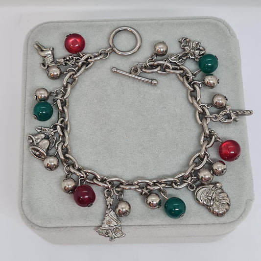 Vintage Christmas bracelet. Silver-tone chain with green and red plastic beads and Christmas-themed charms.