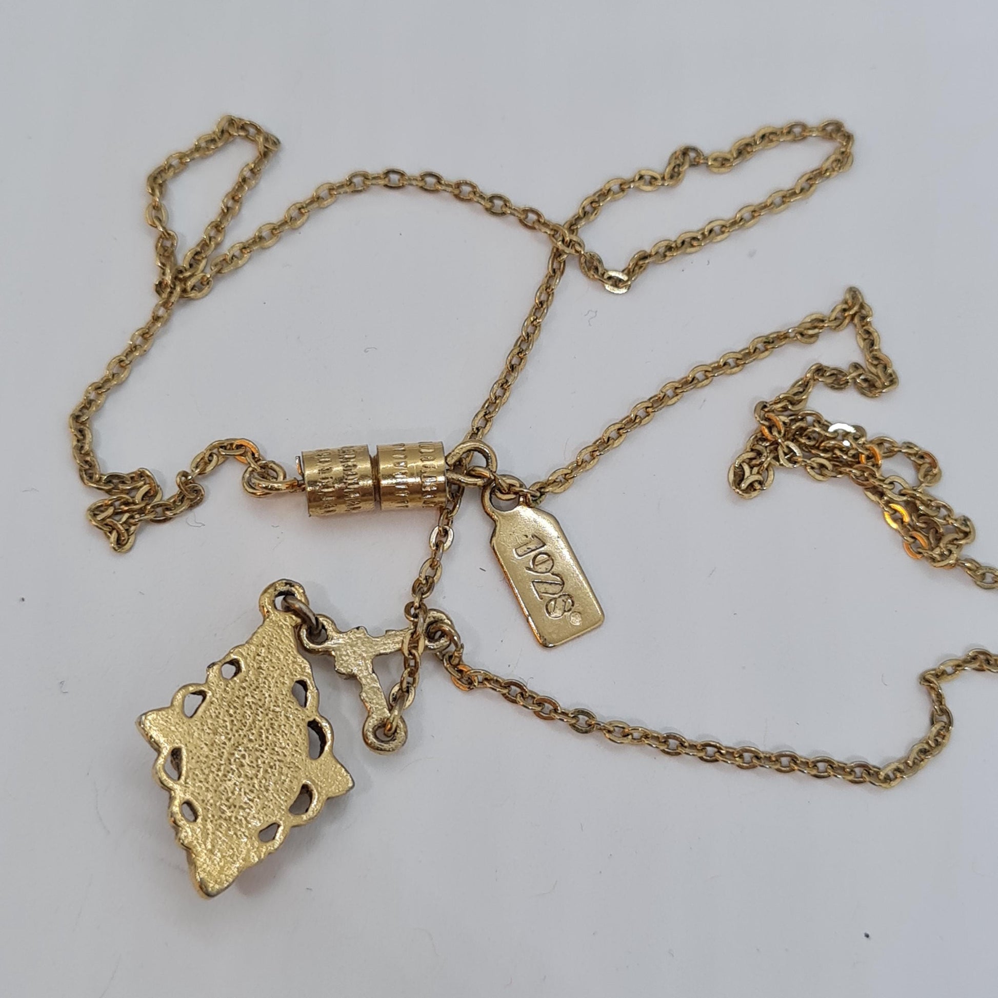 Vintage 1928 JEWELRY pendant necklace Gold-tone chain and tiny pendant with blue glass cabochon
