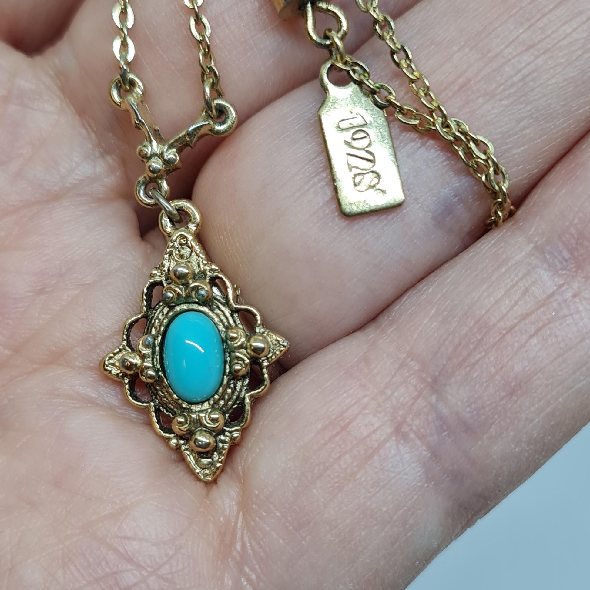 Vintage 1928 JEWELRY pendant necklace Gold-tone chain and tiny pendant with blue glass cabochon
