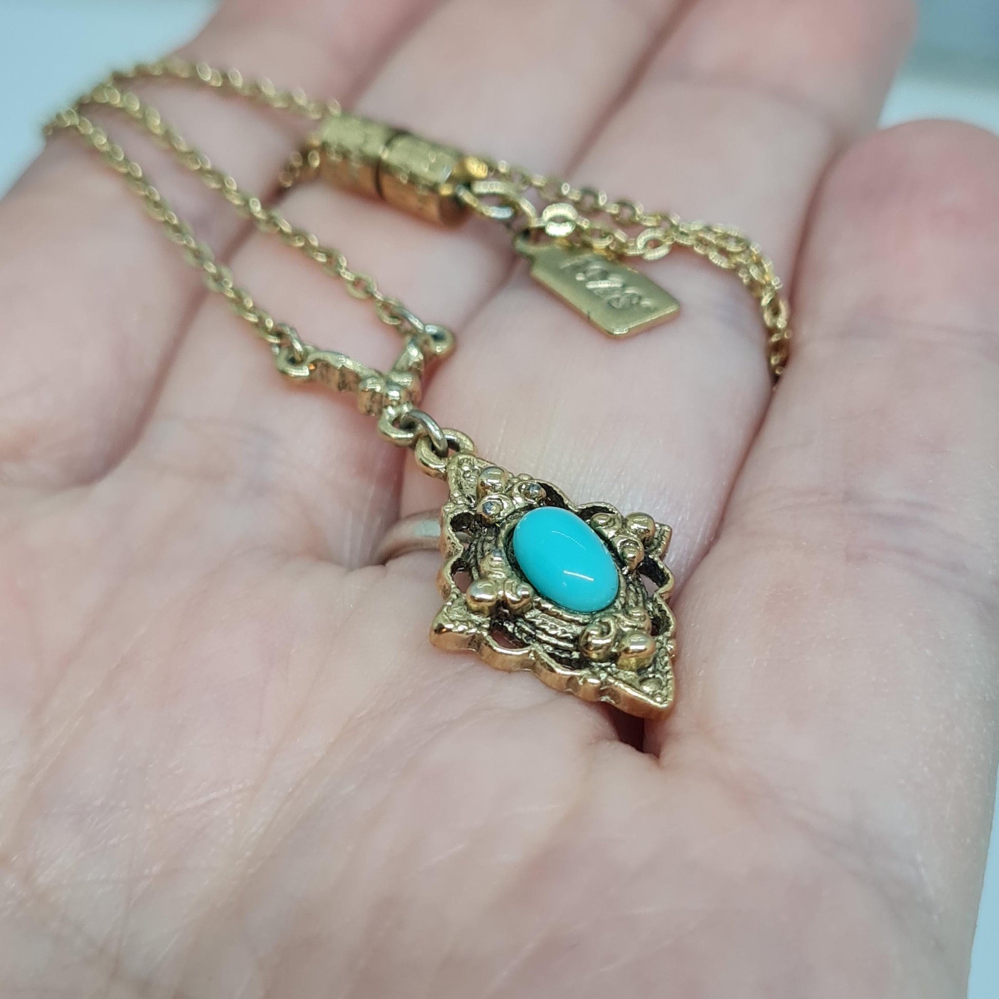 Vintage 1928 JEWELRY pendant necklace Gold-tone chain and tiny pendant with blue glass cabochon