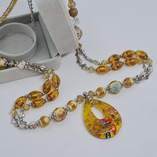 Vintage glass pendant necklace. Yellow-tone glass beads with silver-tone details necklace.