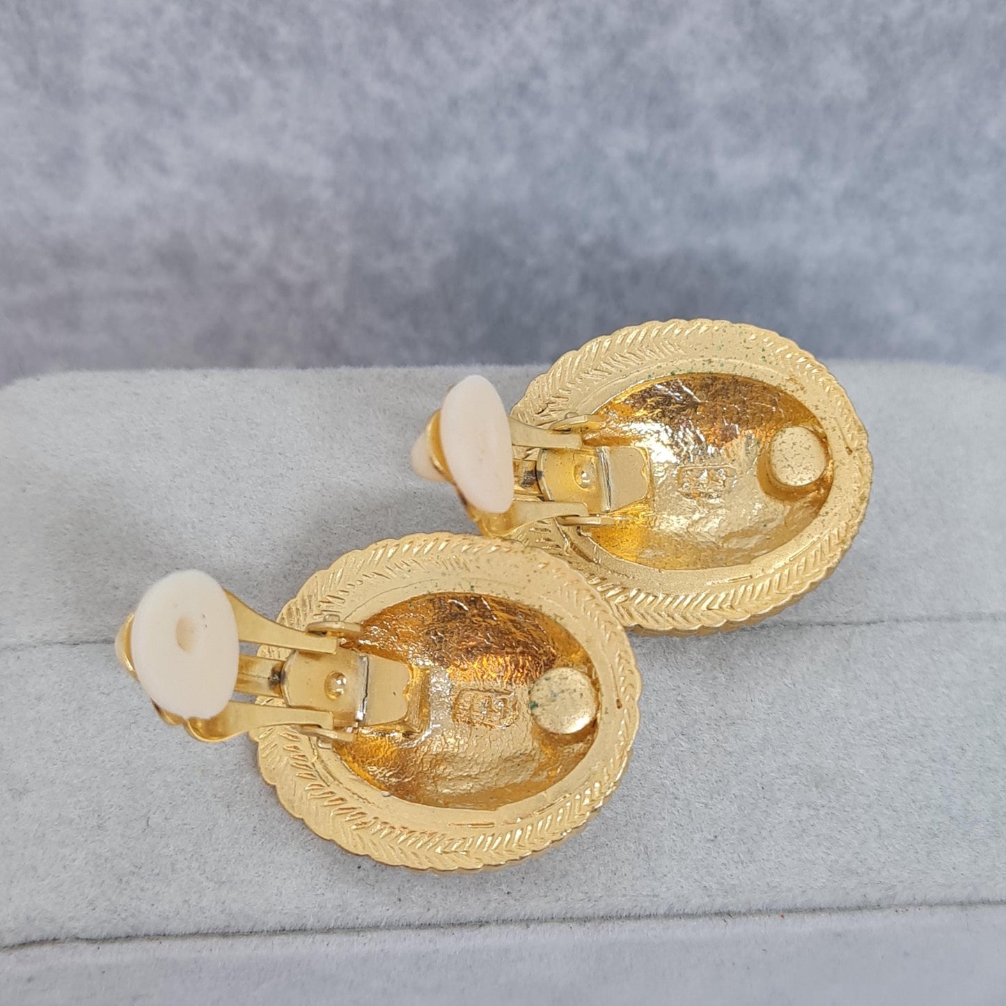 Vintage heraldic style clip-on earrings Matte gold tone textured metal oval clip earrings