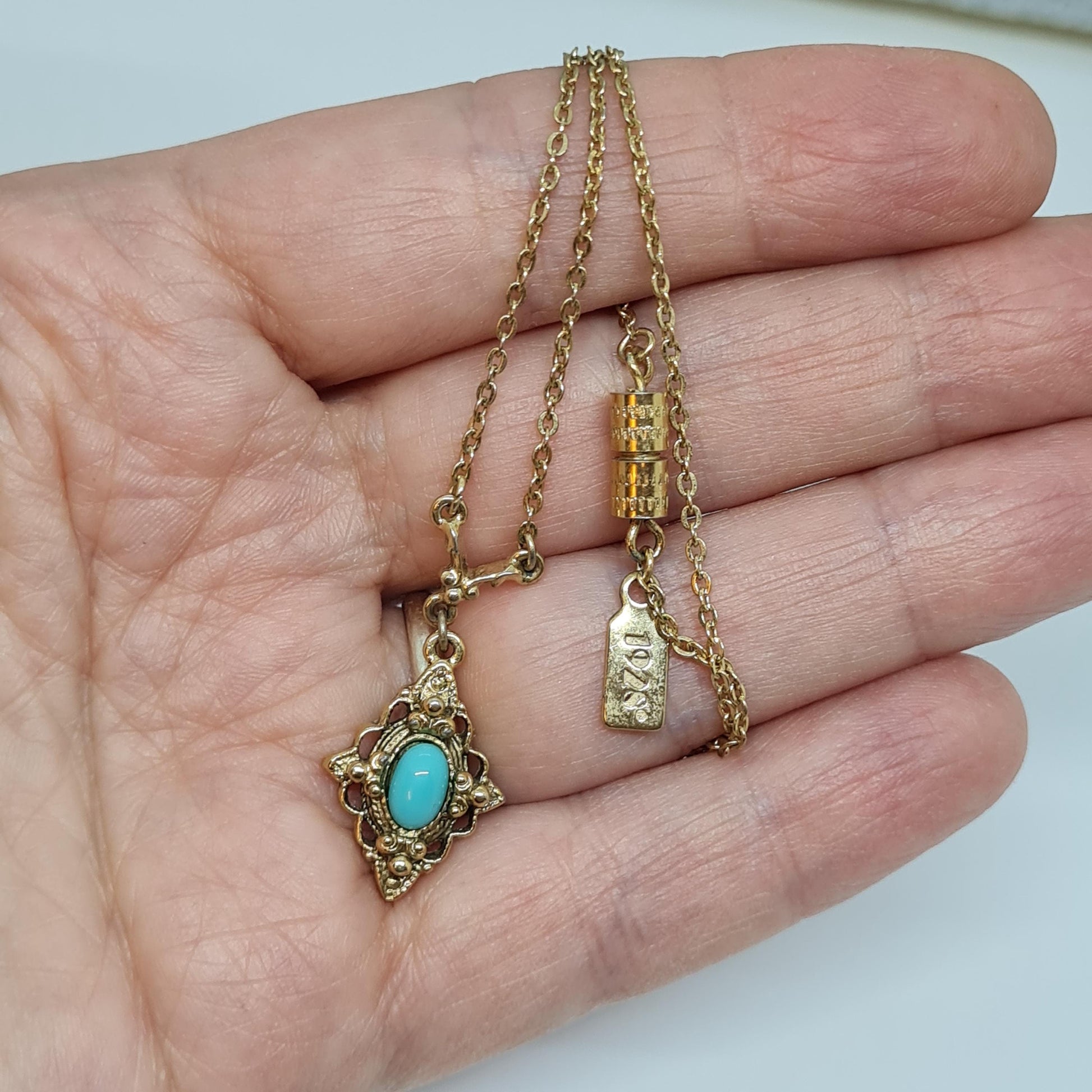 Vintage 1928 JEWELRY pendant necklace Gold-tone chain and tiny pendant with blue glass cabochon