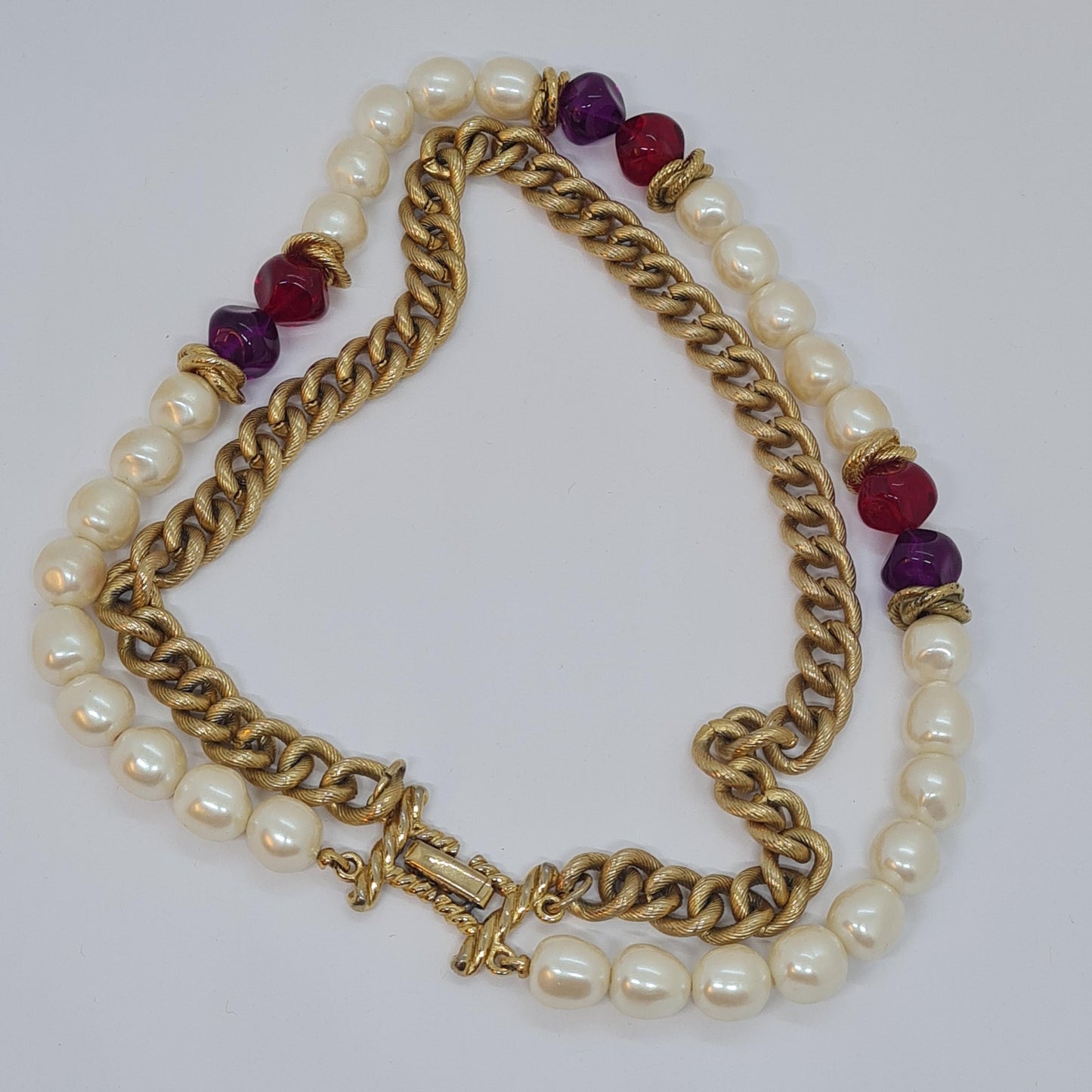 Vintage two-strand necklace with a gold-tone chain, plastic beads, and faux pearls.