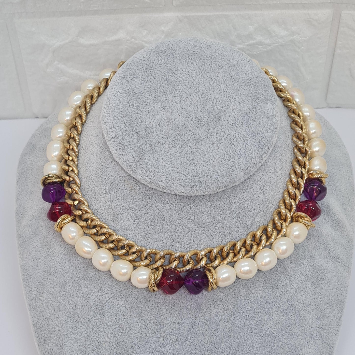 Vintage two-strand necklace with a gold-tone chain, plastic beads, and faux pearls.