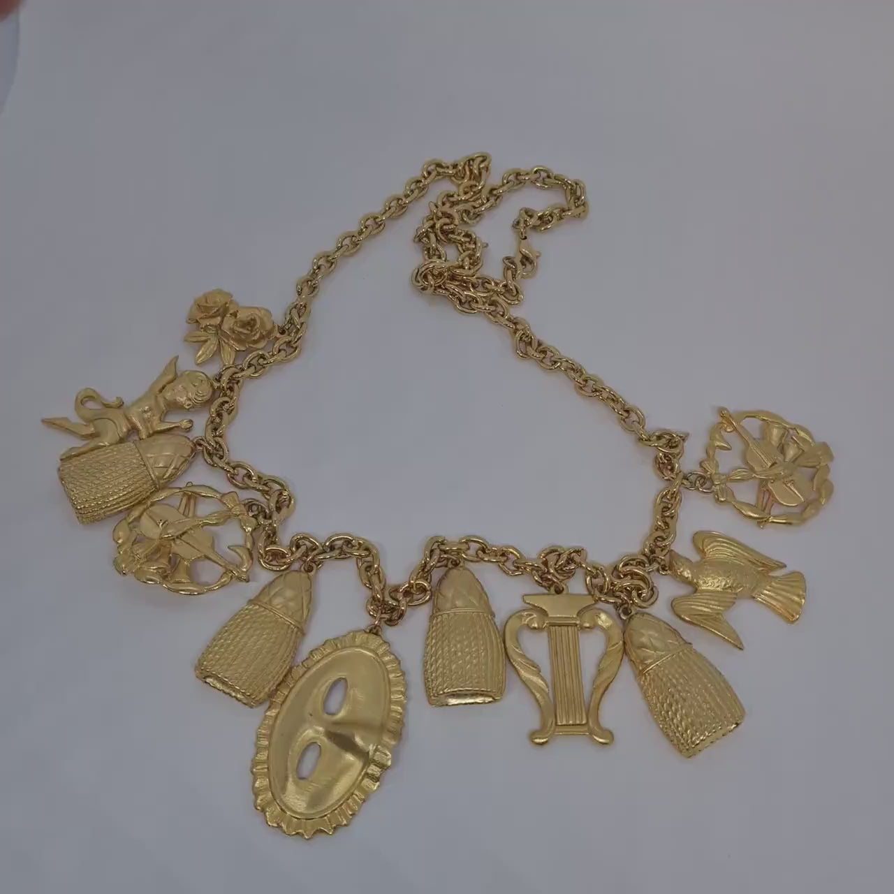 Vintage music-themed pendant necklace Gold-tone metal chain with Arfa, tassel, mask, violin pendants Original pendant necklace